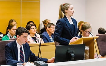 Students participating in a moot court session.